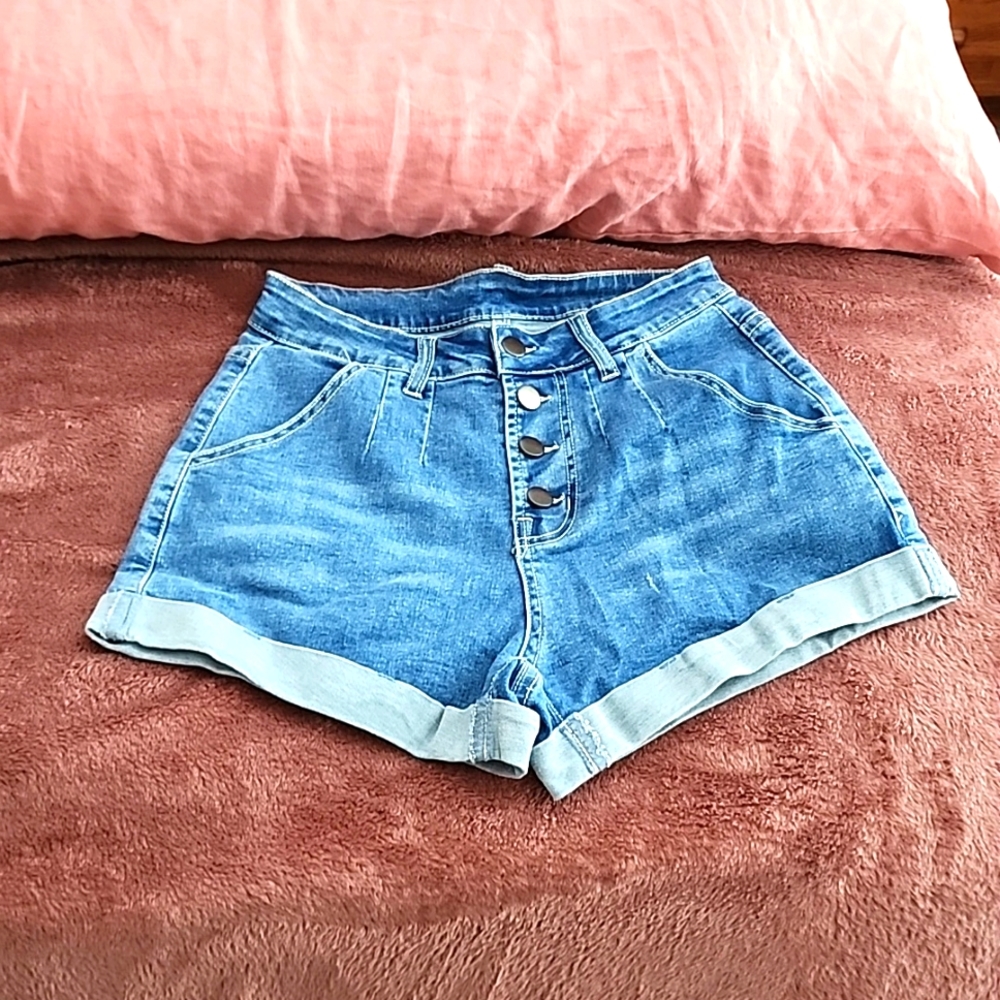 High waisted denim shorts with buttons.